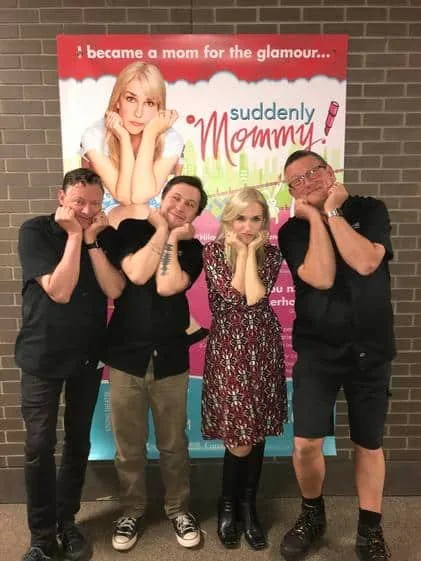 Anne Marie with fans in front of a Suddenly Mommy! banner