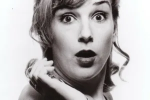 Black-and-white photo of Anne Marie looking shocked